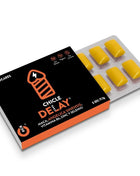 Schwarze und orange box wug sex sense cum delayer verzögerungskaugummis mit gelben rechteckigen stückchen im blister