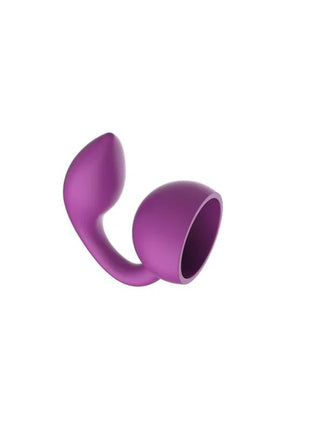Lila silikon massager xocoon mit gebogenem griff und rundem, hohlem kopf in fuchsienfarbe